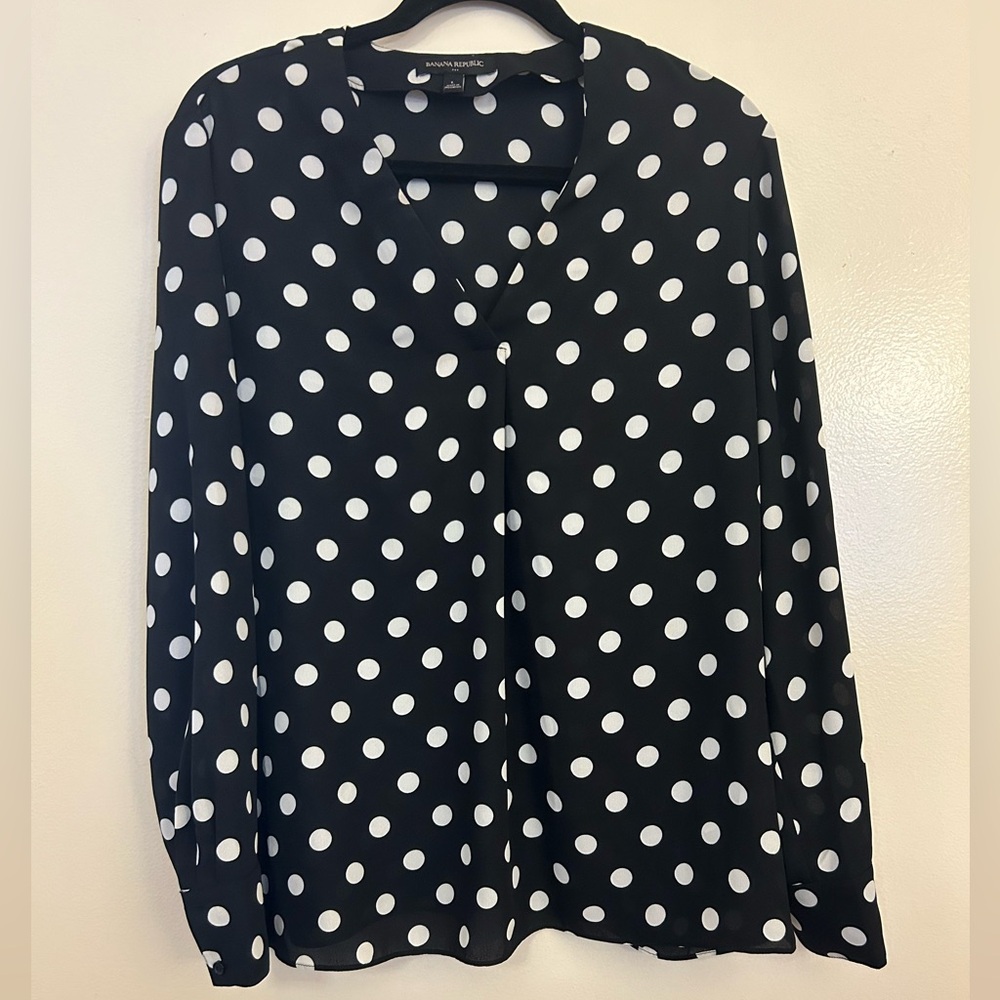 Back and white polka dot v-neck blouse. Size L